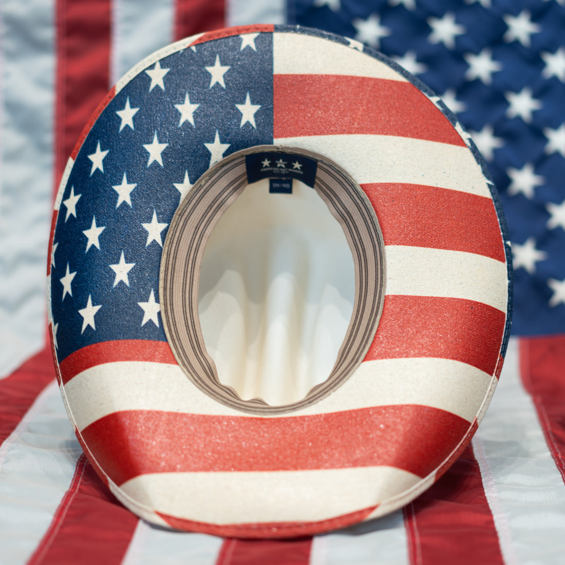 Cowboy hat with American flag pattern on a background of the American flag. KTM Flag Cowboy Hat Bottom