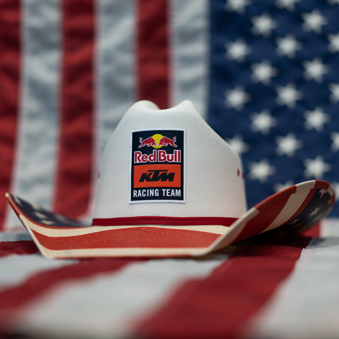 Cowboy hat with Red Bull KTM Racing Team logo on an American flag background
