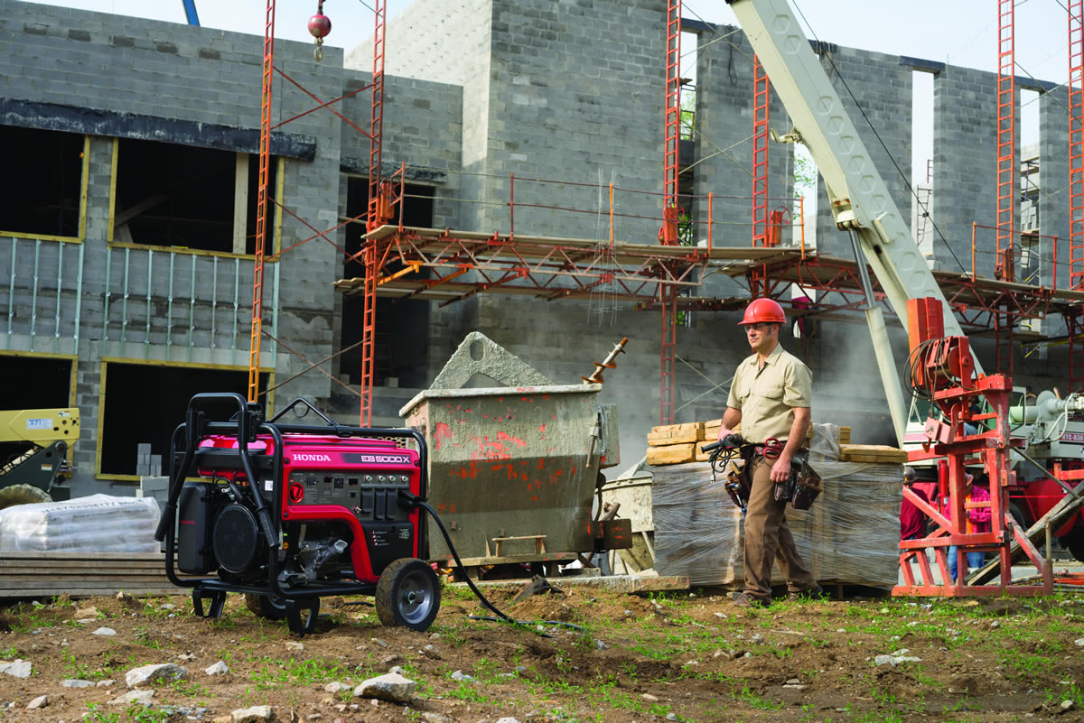 Honda EB5000 OSHA compliant generator powering tools at a worksite