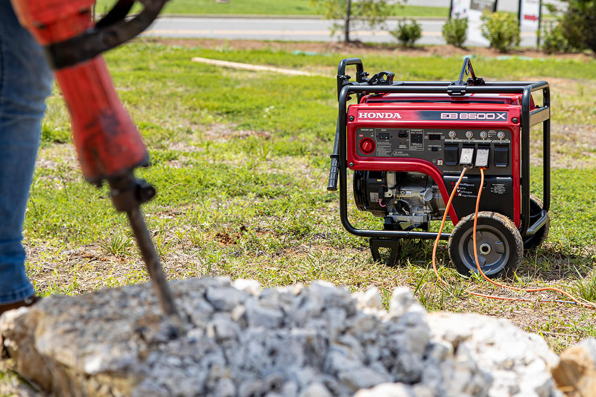 Honda EB6500 portable industrial generator in outdoor use