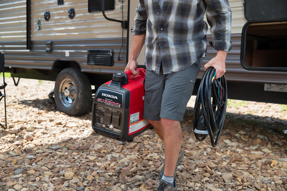 Carrying the 47 lb Honda EU2200i Companion generator at a campsite