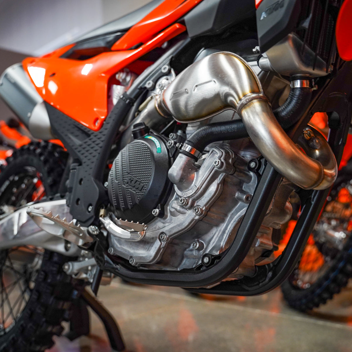Close-up of a motorcycle engine with visible branding