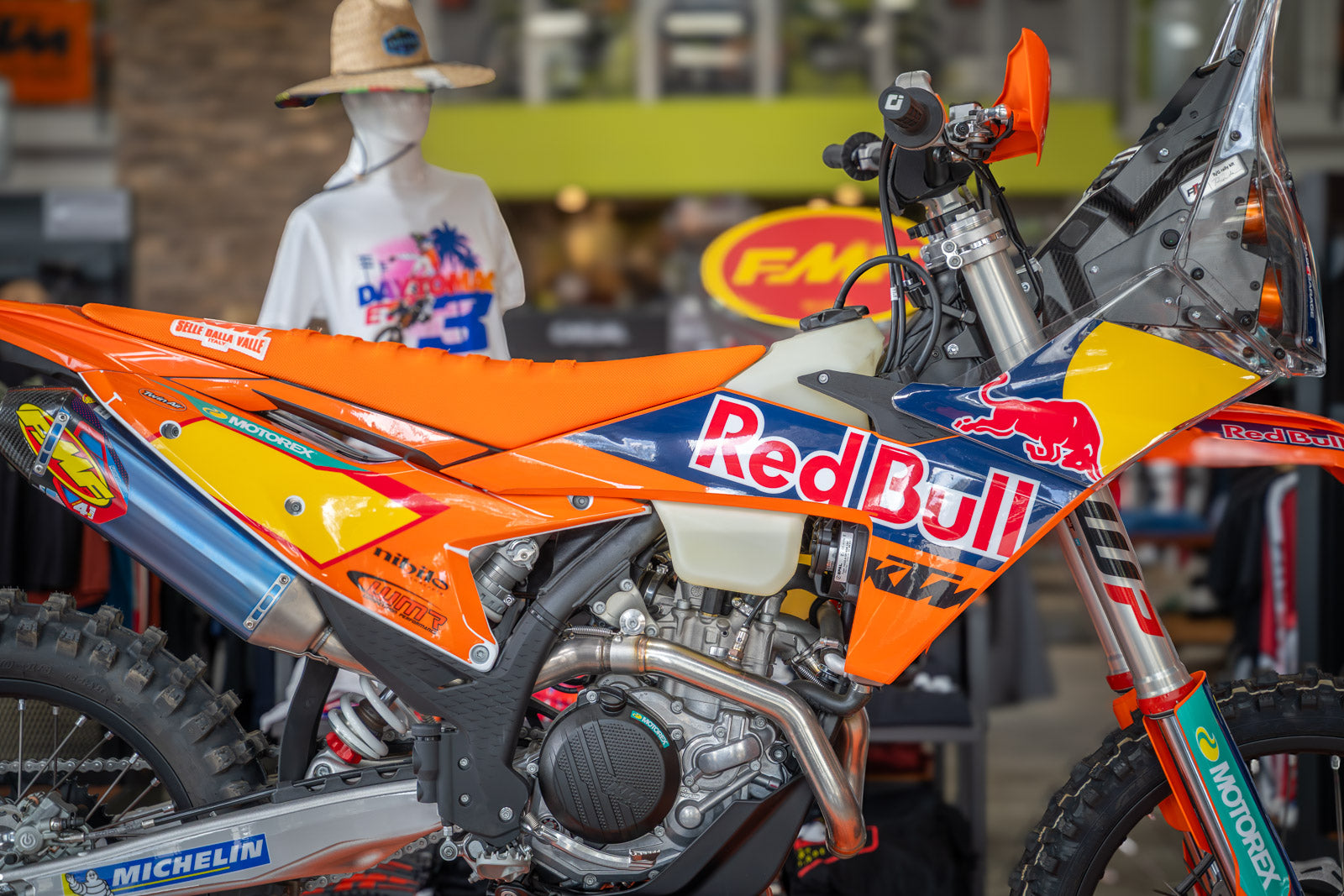 Close-up of a KTM Red Bull Custom Graphics on 500 XW-F dirt bike with a blurred background