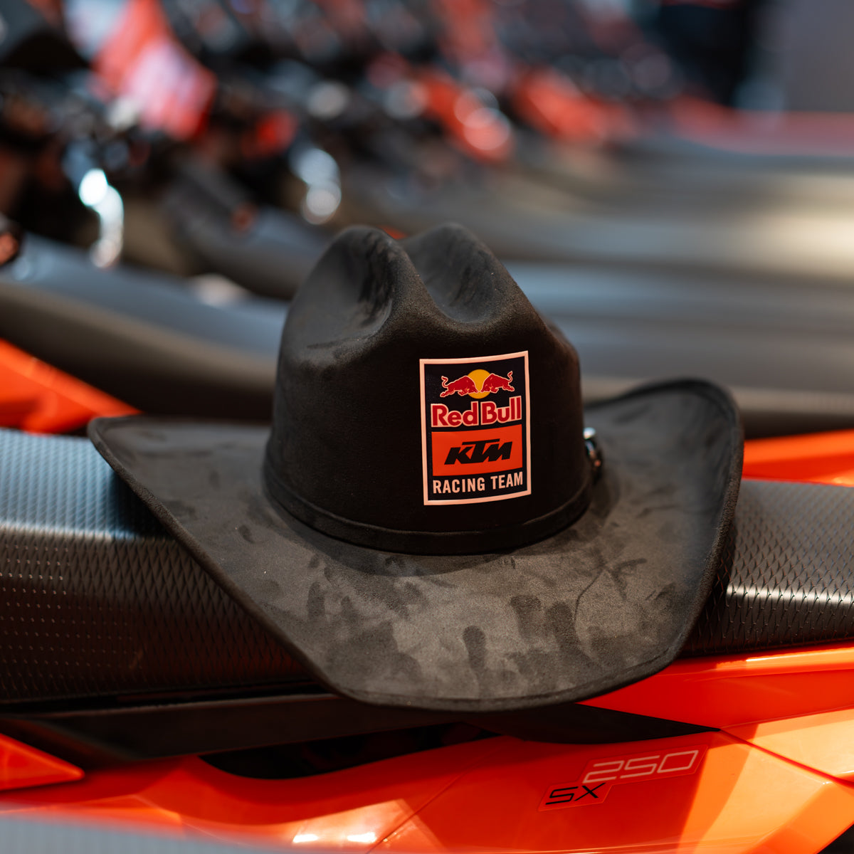 Black cowboy hat with Red Bull KTM Racing Team logo on a motorcycle