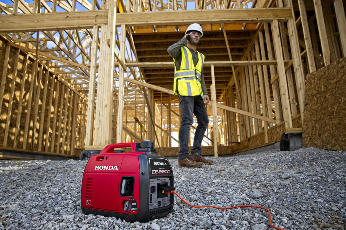 Honda EB2200i generator alongside a smartphone on the jobsite