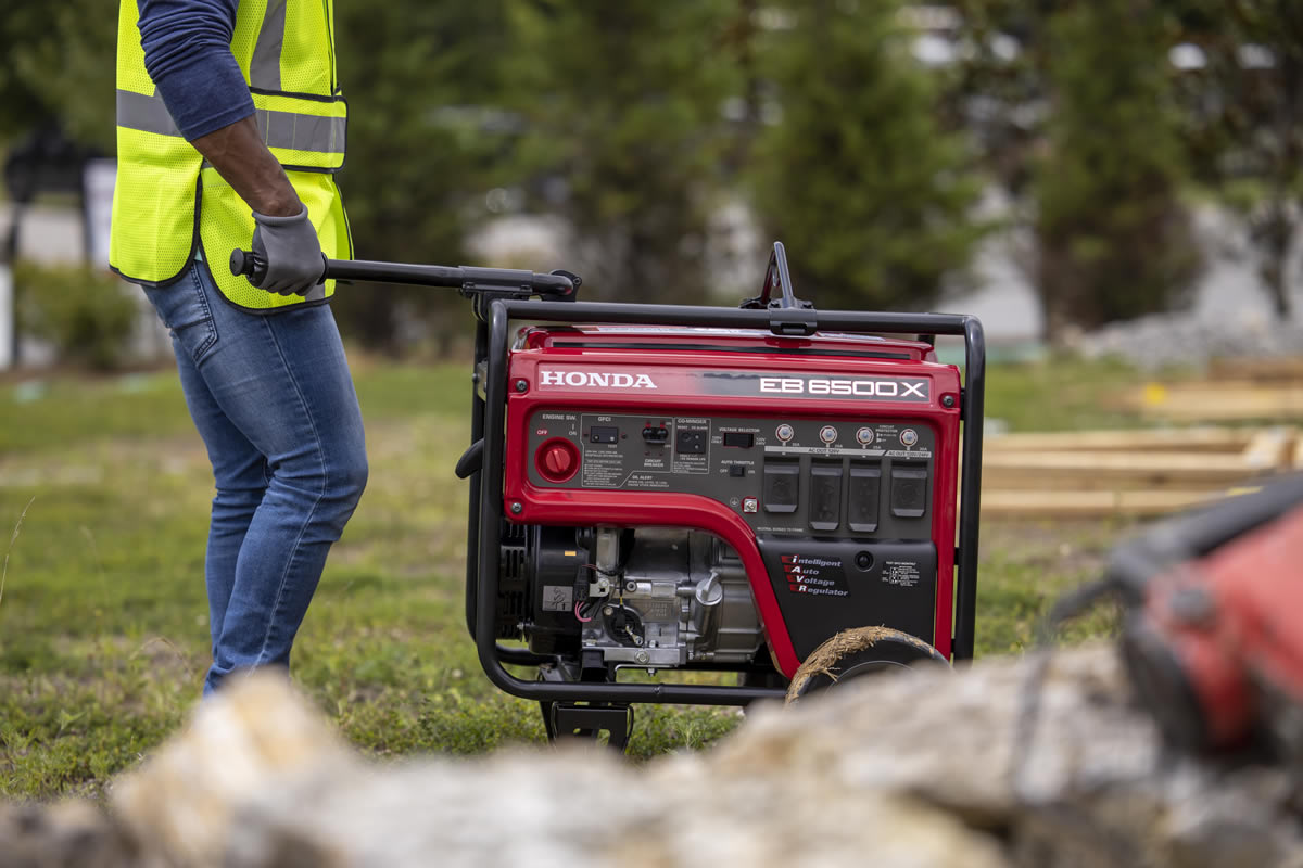 Honda EB6500 industrial generator powering equipment on a jobsite